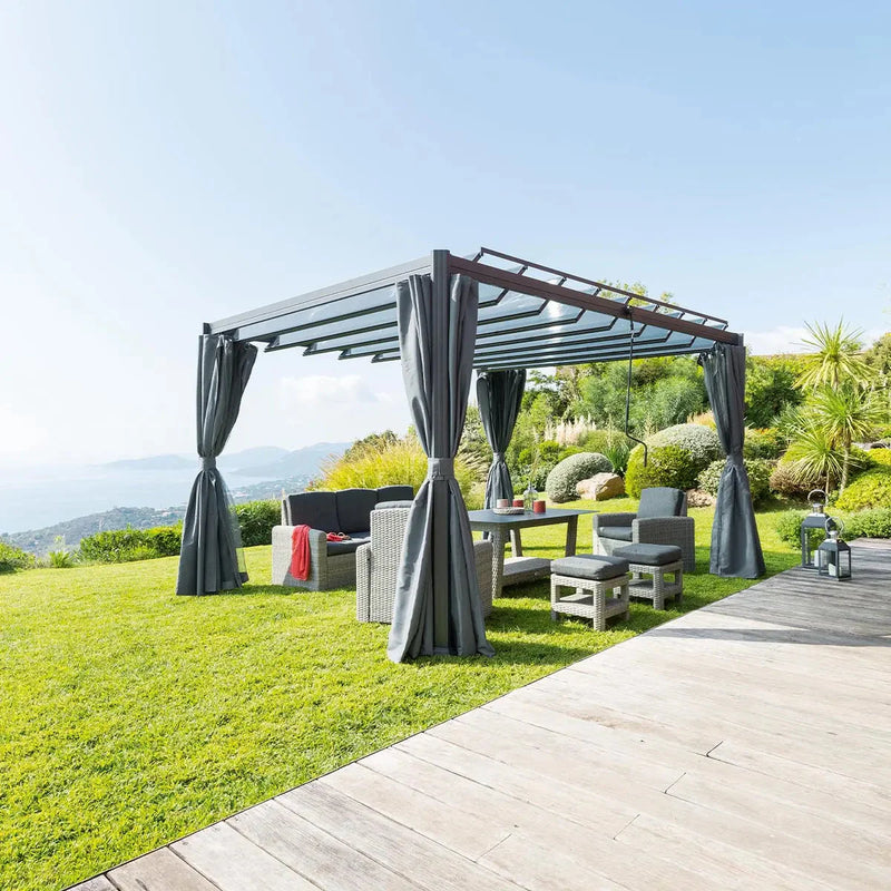 garden space with a pergola and seating underneath on green grass