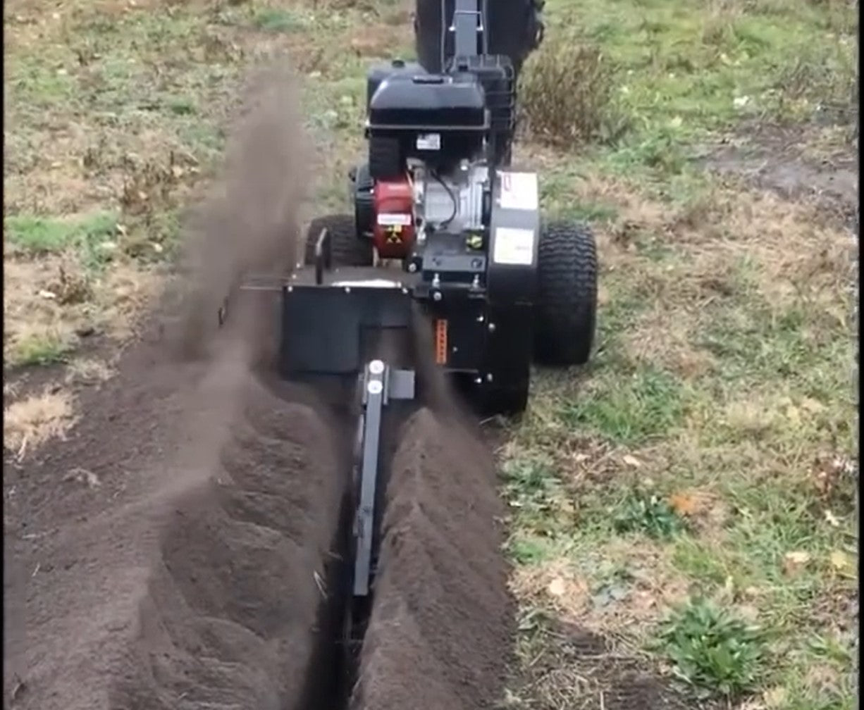 a Jansen GF-600PRO making a trench in a grass filed with soil piled on one side of the trench